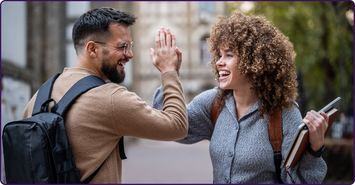 Two students doing a high five